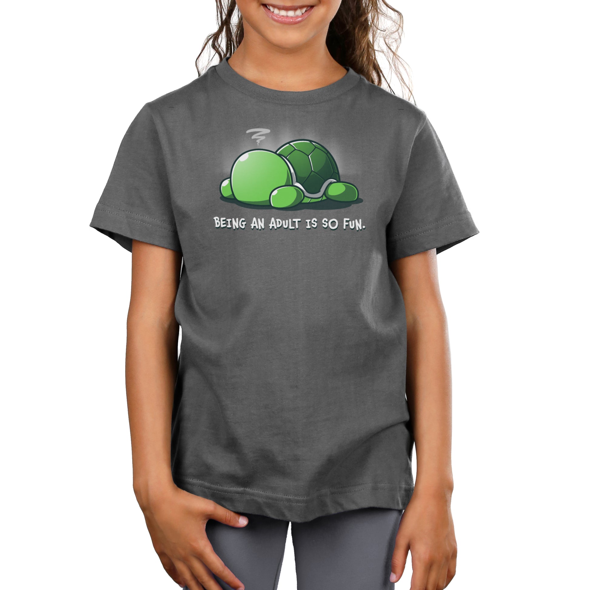 Premium Cotton T-shirt - A smiling child wearing a super soft ringspun cotton dark gray apparel with a cartoon turtle and the text "Being An Adult Is So Fun" by monsterdigital.