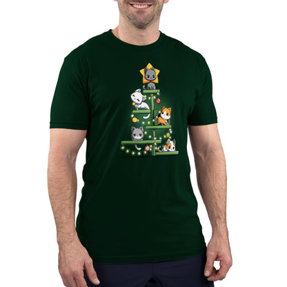 A person wearing a Kitty Christmas Tree by monsterdigital — a super soft ringspun cotton forest green t-shirt with an illustration of five cats arranged like a Christmas tree, decorated with lights and a star on top.