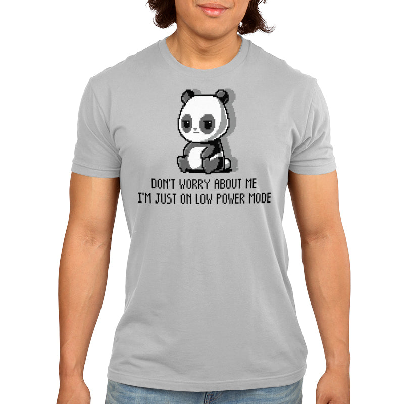 Person wearing a light grey, super soft ringspun cotton unisex tee with an image of a tired panda and the text "DON'T WORRY ABOUT ME, I'M JUST ON LOW POWER MODE" by monsterdigital called Low Power Mode.
