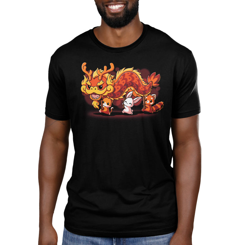 A person is wearing "The Dragon Dance" by monsterdigital, a super soft ringspun cotton unisex tee featuring a cartoon illustration of a dragon and three small animals walking together, perfect for celebrating Lunar New Year.