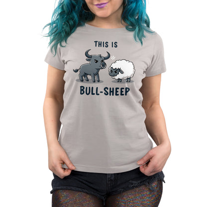 Premium Cotton T-shirt - Person wearing a gray monsterdigital apparel made of super soft ringspun cotton, featuring an illustration of a bull and a sheep, with the text "THIS IS BULL-SHEEP." The individual has blue hair and is also dressed in black shorts.