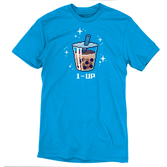 A cobalt blue T-shirt featuring a pixel art image of a bubble tea drink with a straw, surrounded by sparkles, and the text 