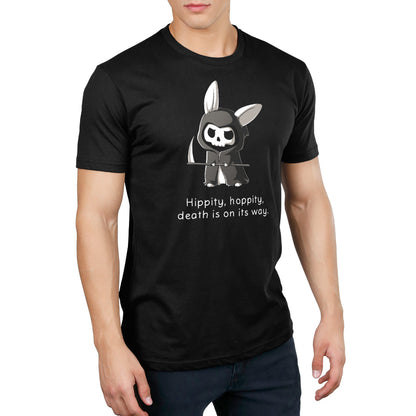 Premium Cotton T-shirt_Teeturtle Grim Bunny (Glow) Black Featuring a hooded, Grim Reaper-looking bunny with a skull face and a scythe with 'Hippity, hoppity, death is on its way.' written beneath.