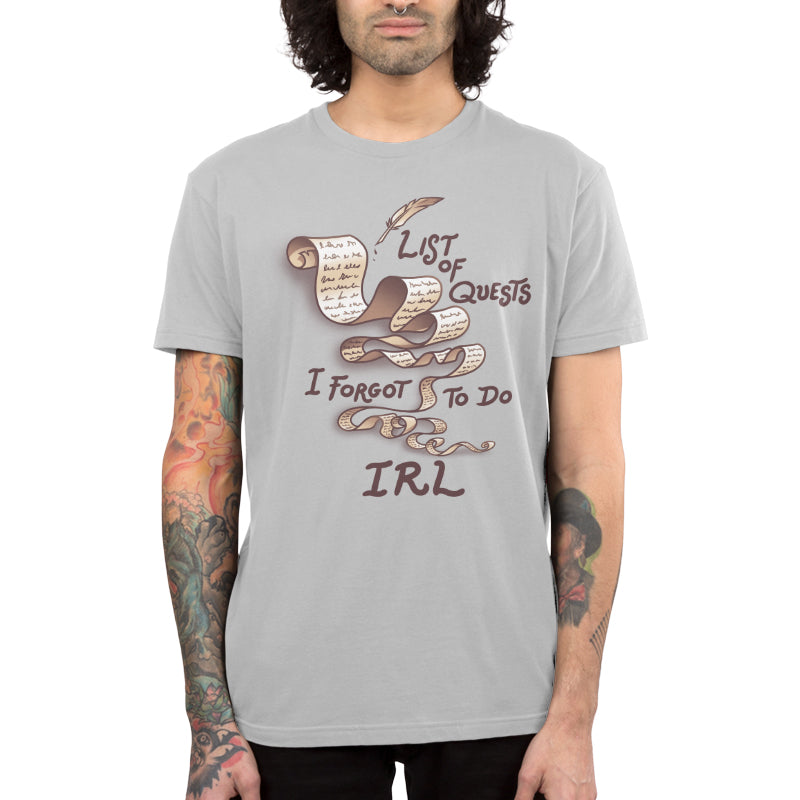 Premium Cotton T-shirt_TeeTurtle Unfinished Quests silver gray t-shirt featuring a long, brownish-tan scroll with script like text giving it a vintage look and a feather quill pen in the top right. "LIST OF QUESTS I FORGOT TO DO IRL" is written around the scroll. 