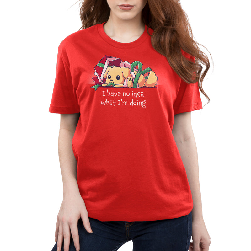 Premium Cotton T-shirt_TeeTurtle red Presently Confused apparel featuring a dog tangled up in wrapping paper and ribbon, with the caption, “I Have No Idea What I’m Doing”. 