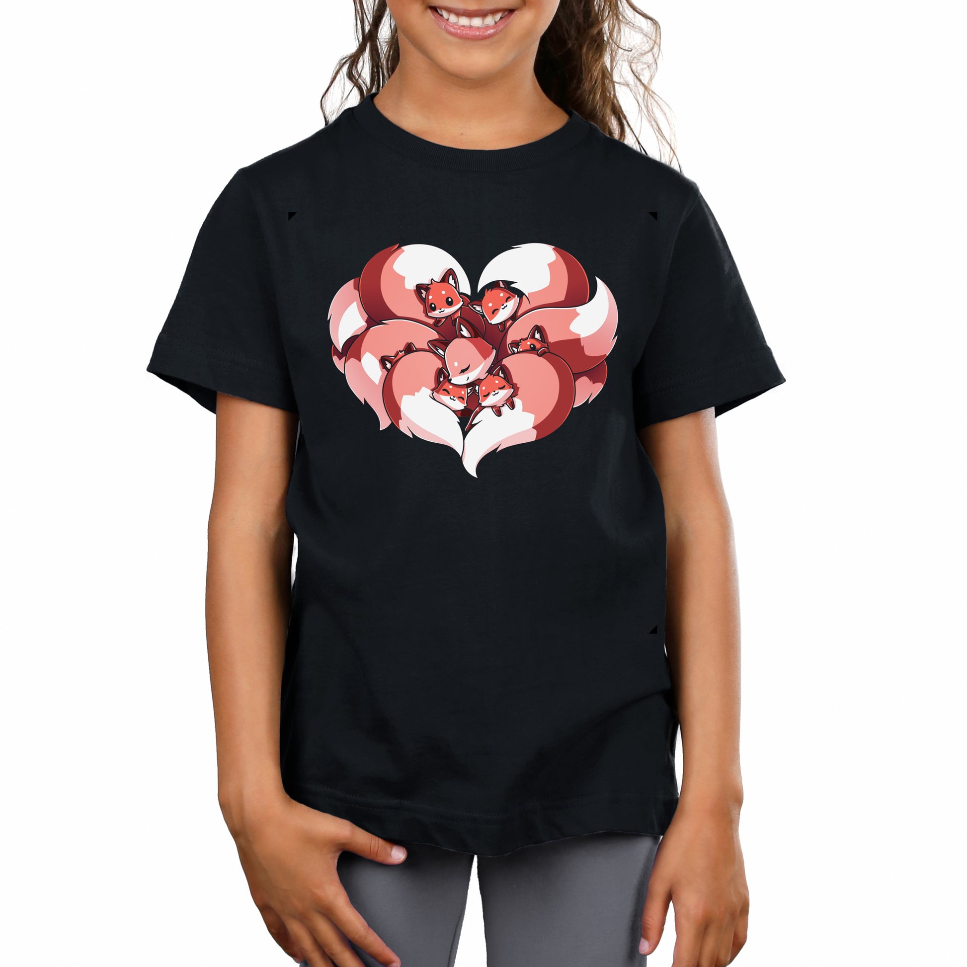 A child wearing a "A Mother's Love" t-shirt by monsterdigital, made from 100% super soft ringspun cotton, features a design of three red foxes in a heart shape.