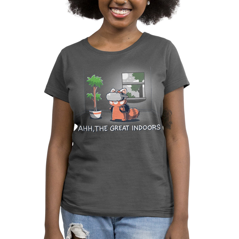 A woman wears a charcoal t-shirt featuring a cartoon red panda indoors, with text reading "AHH, THE GREAT INDOORS." The super soft ringspun cotton ensures maximum comfort. The Ahh, The Great Indoors by monsterdigital guarantees to keep you cozy and stylish.