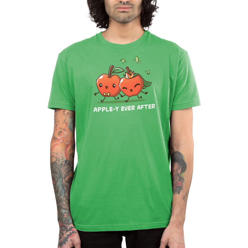 Premium Cotton T-shirt - Person wearing an apple green apparel with cartoon apples holding hands and the text "APPLE-Y EVER AFTER." This unisex tee, Apple-y Ever After by monsterdigital, is made from 100% super soft ringspun cotton, ensuring comfort and style for everyone.