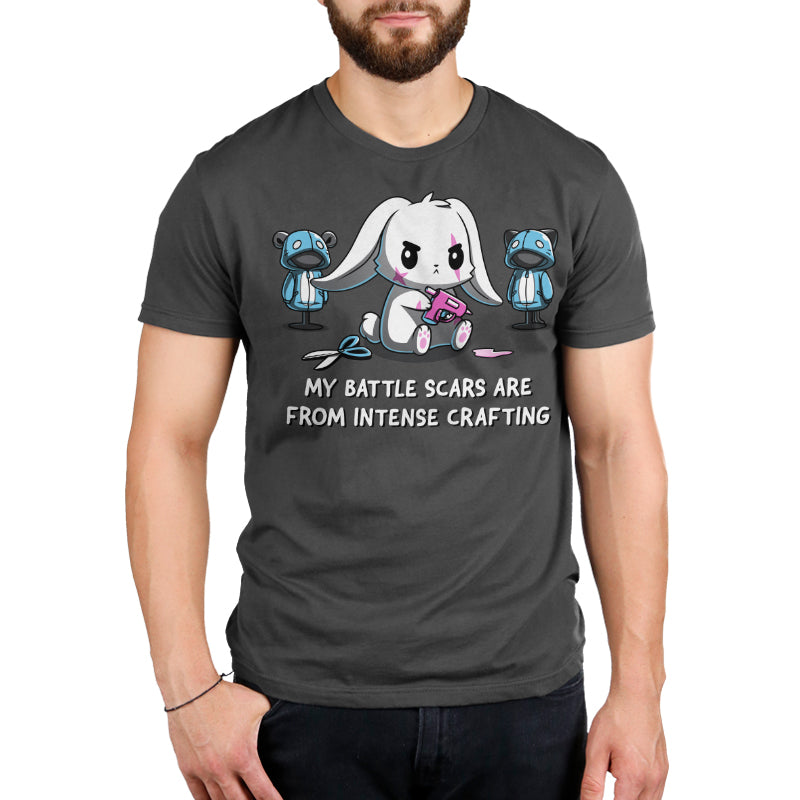 Premium Cotton T-shirt - A person wearing a charcoal gray apparelfeaturing a cartoon rabbit with sewing tools and the text "My battle scars are from intense crafting," highlighting the super soft ringspun cotton of this perfect crafting apparel, Battle Scars by monsterdigital.
