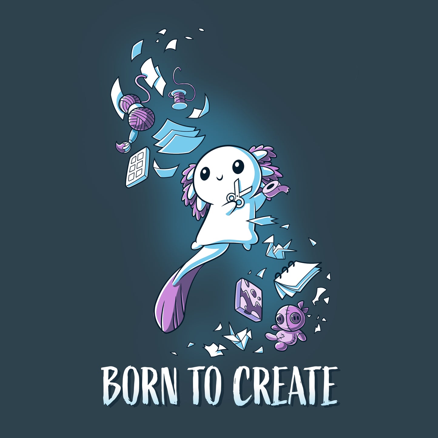 A whimsical character hovers amidst craft supplies like yarn, paper, and a sewing kit with the text "BORN TO CREATE" below on a super soft ringspun cotton T-shirt in denim blue from monsterdigital's Born to Create collection.