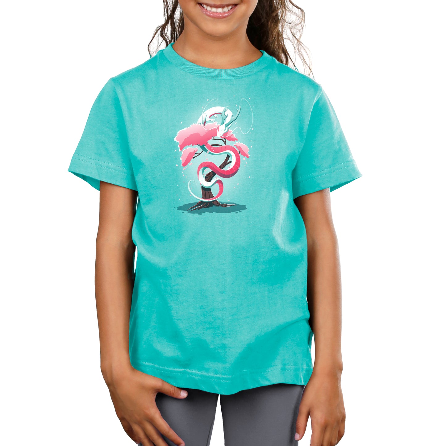 Young girl wearing a Caribbean blue t-shirt featuring the Cherry Blossom Dragon by monsterdigital, winding gracefully around a pink tree.