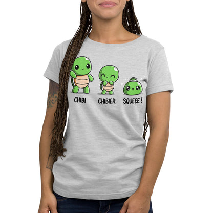 Premium Cotton T-shirt - A person is wearing a light gray monsterdigital apparel with three cartoon green turtles labeled "Chibi," "Chibier," and "Squeee!".