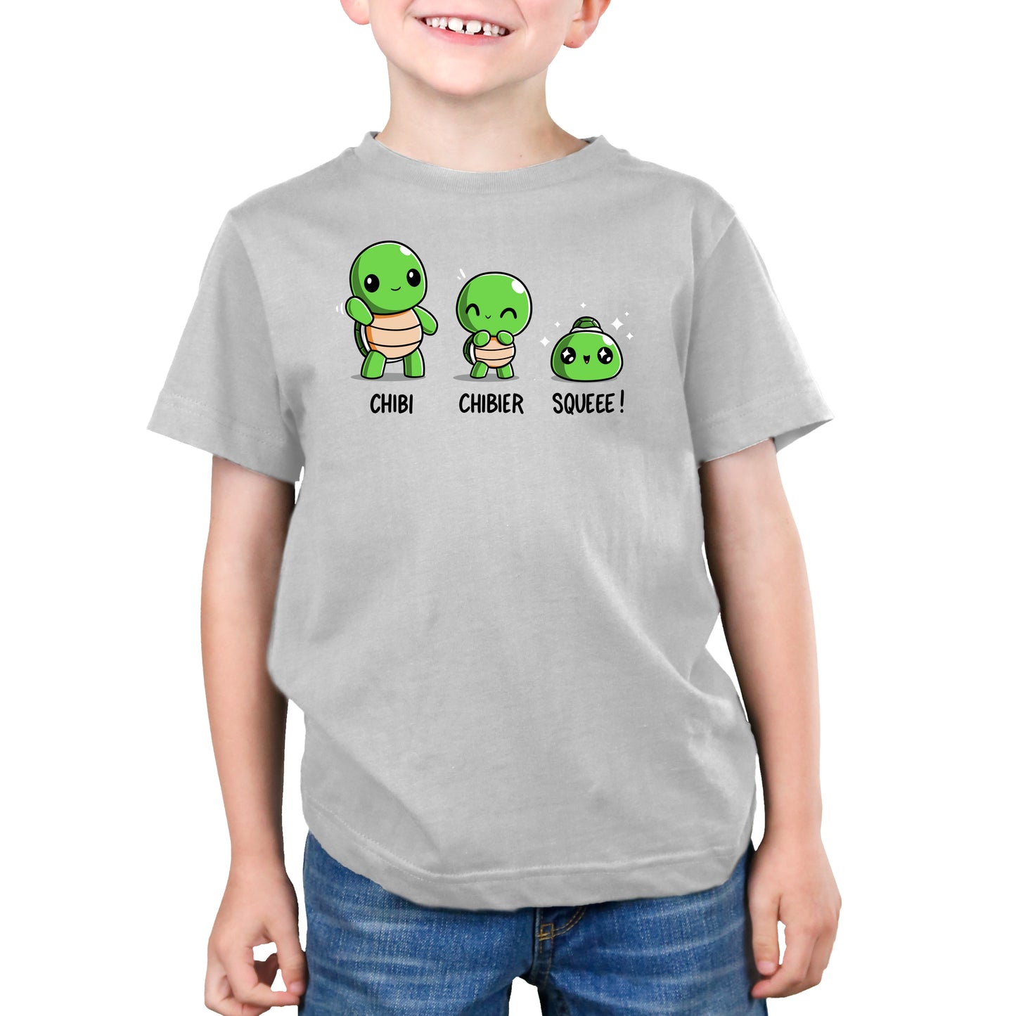 Premium Cotton T-shirt - A child wearing a grey monsterdigital apparel with three cute turtle illustrations labeled "Chibi, Chibier, Squeee!" is smiling and standing with hands by their sides. The super soft ringspun cotton makes it even more adorable.