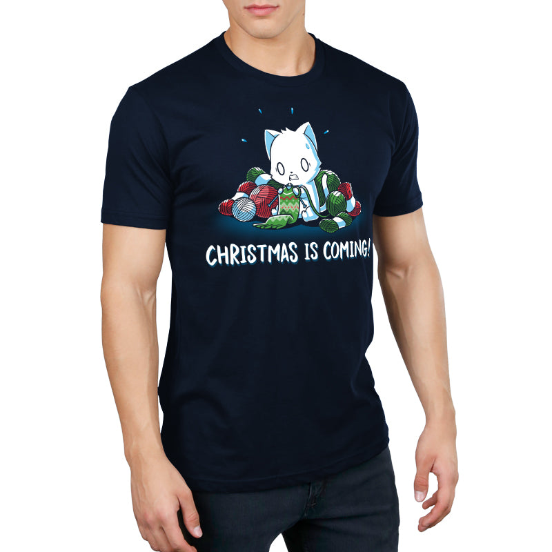 Premium Cotton T-shirt_TeeTurtle Christmas is Coming! navy blue t-shirt featuring an anxious cat that is crafting gifts for Christmas