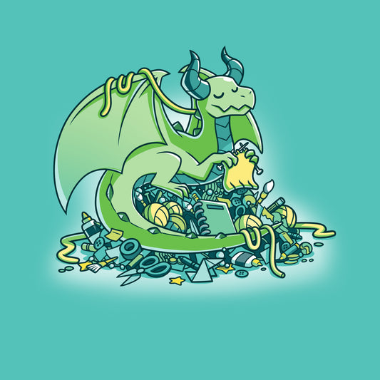 Illustration of a green dragon sitting atop a pile of assorted treasures and junk, holding a yellow gem. The background features a craft hoarder's dream—a Caribbean Blue T-shirt and super soft ringspun cotton fabric scattered among the riches, proudly displaying the Craft Hoarder by monsterdigital.