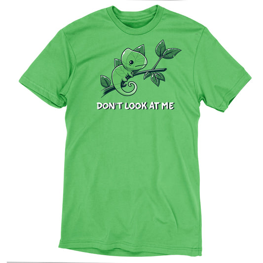 Premium Cotton T-shirt_Teeturtle Don't Look At Me Apple Green Featuring a little cartoon Chameleon trying to cloak itself against leaves while on a branch with 'Don't look at me.' written underneath the image.