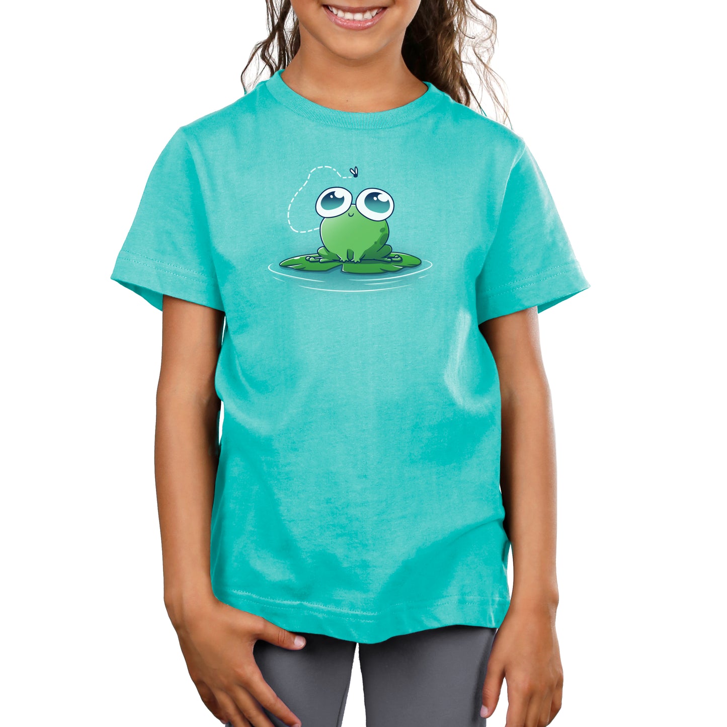 Premium Cotton T-shirt - A young girl wearing a Caribbean blue apparel with an illustration of a cartoon frog sitting on a lily pad, with a small flying insect above its head. The super soft ringspun cotton ensures she's comfortable while her monsterdigital Eyes On the Prize smile adds charm to her outfit.