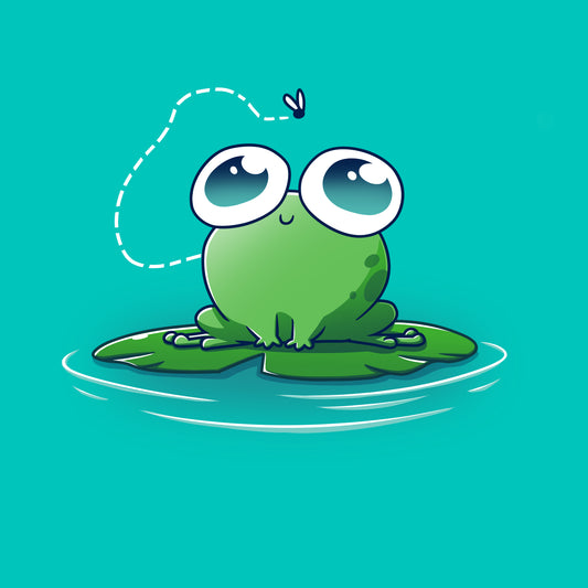 A cartoon frog with large eyes sits on a lily pad, wearing a Caribbean blue t-shirt that reads 