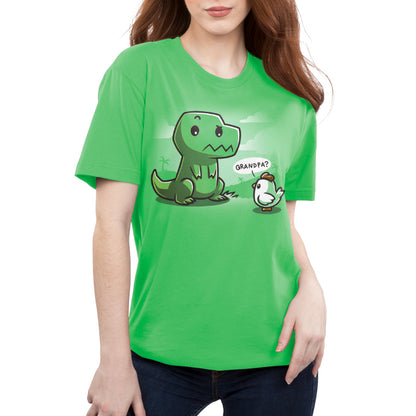 Person wearing a green unisex tee made of super soft ringspun cotton, featuring a cartoon dinosaur sitting with a cartoon chick saying "Grandpa?" - "Family Reunion" by monsterdigital.