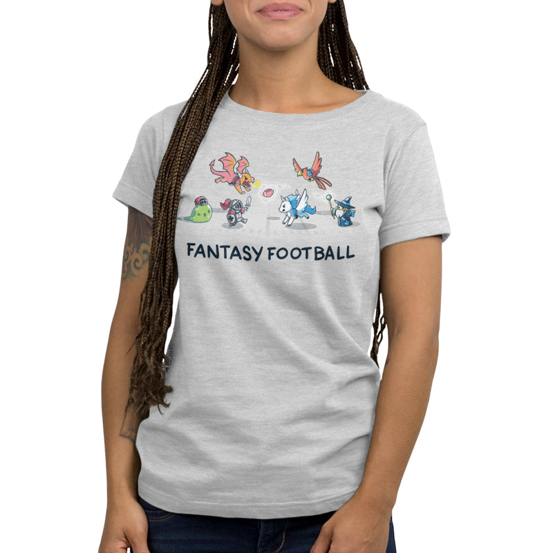 Person wearing a super soft ringspun light gray unisex cotton tee with "Fantasy Football" text and cartoon fantasy creatures playing football by monsterdigital.