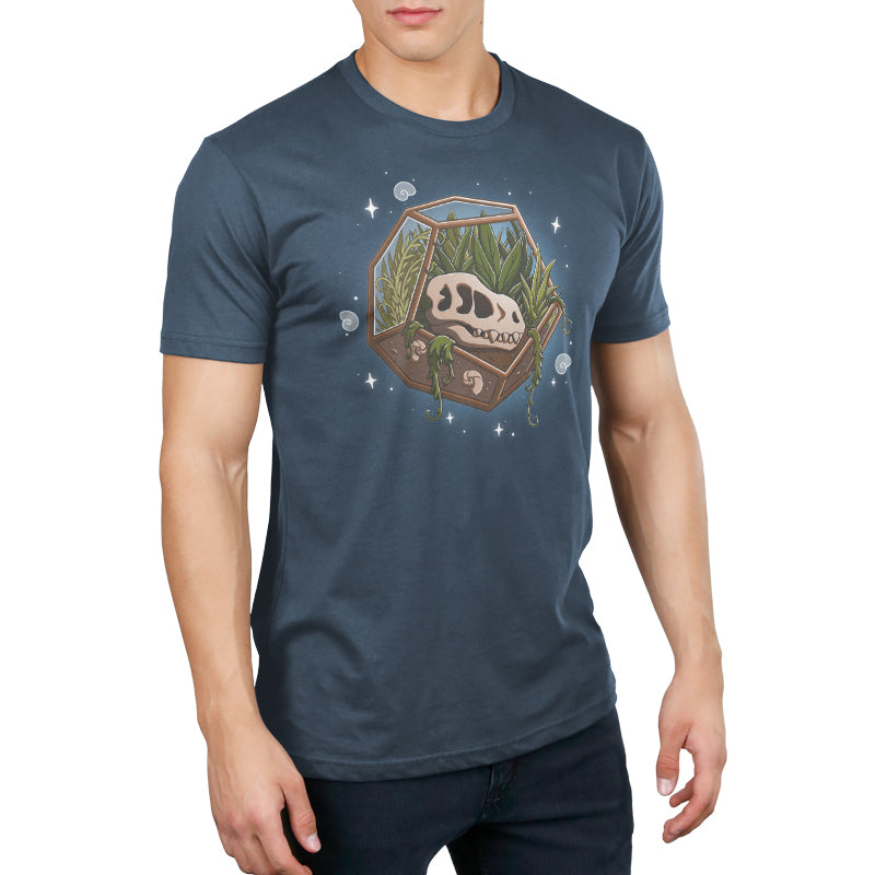 Premium Cotton T-shirt - A man wearing a super soft ringspun cotton blue Flora & Fossils apparel by monsterdigital with an illustrated design of a terrarium containing a dinosaur skull, plants, and small rocks.