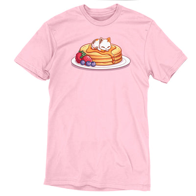 Premium Cotton T-shirt_TeeTurtle light pink Fluffy Pancakes apparel featuring a calico cat sleeping on top of a stack of syrupy pancakes with strawberries, and blueberries on the side.