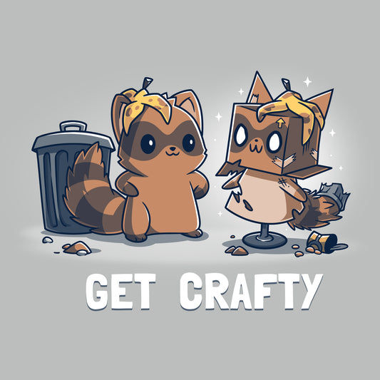 Illustration of a Crafty Raccoon beside a cardboard Crafty Raccoon both wearing leaf hats, featured on a unisex tee with the phrase 