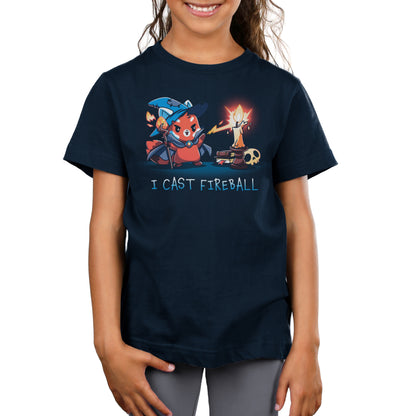 A child wearing a navy blue I Cast Fireball t-shirt by monsterdigital, made of super soft ringspun cotton, featuring a cartoon bear wizard casting a fireball spell. The text reads "I CAST FIREBALL".