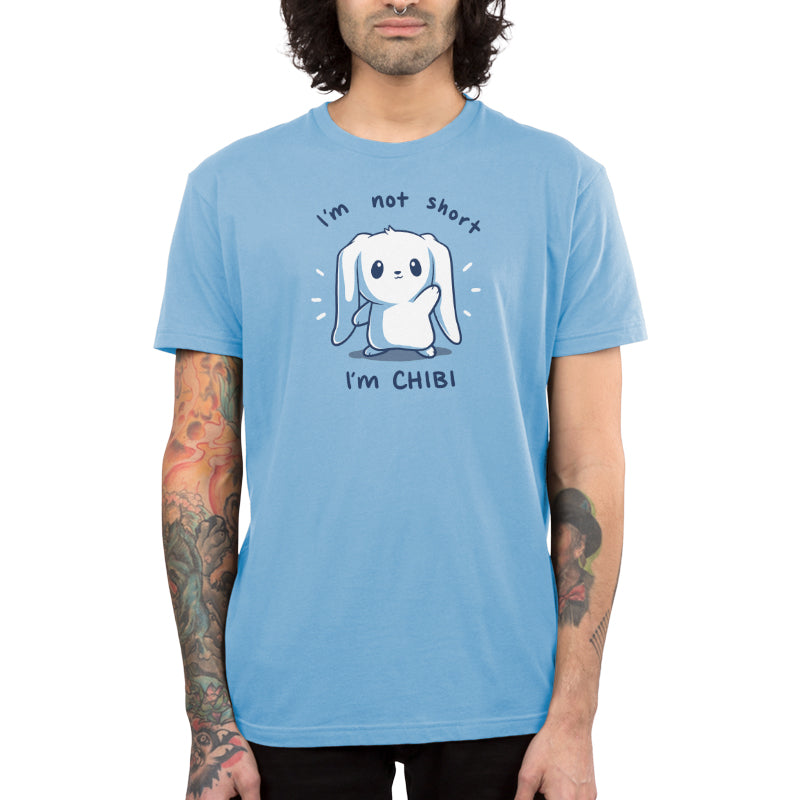 Premium Cotton T-shirt_TeeTurtle I'm Not Short, I'm Chibi! light blue t-shirt featuring a white bunny with long floppy ears waving. "I'm not short" is written on top, and "I'm CHIBI" is written underneath.