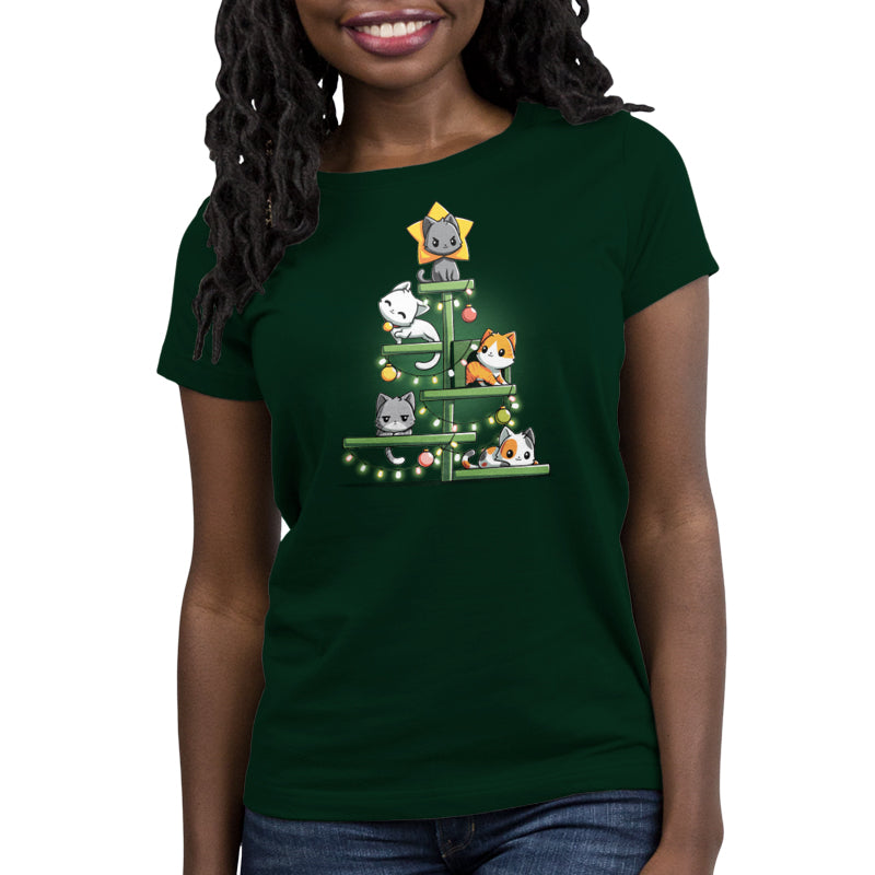 Person wearing a super soft ringspun cotton t-shirt in forest green, featuring a whimsical Christmas tree made of cats, each adorned with ornaments and lights. It's the perfect "Kitty Christmas Tree" shirt for feline lovers by monsterdigital.