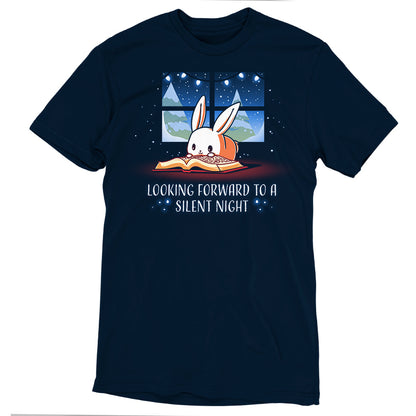 A navy blue T-shirt featuring a cartoon rabbit reading a book by a window under a night sky, made from super soft ringspun cotton. It's accompanied by the text "Looking Forward to a Silent Night." This unisex tee from monsterdigital promises both comfort and whimsical charm.