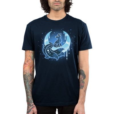 Premium Cotton T-shirt_TeeTurtle navy blue Lunar Kitsune apparel featuring a celestial kitsune perched on the cusp of a crescent moon with its points directed upwards with stars in the background.