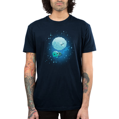 Premium Cotton T-shirt_TeeTurtle navy blue Moonlight Swim apparel featuring a swimming turtle with the full moon reflected on the water’s surface, and a dragonfly floating above the moon’s reflection.