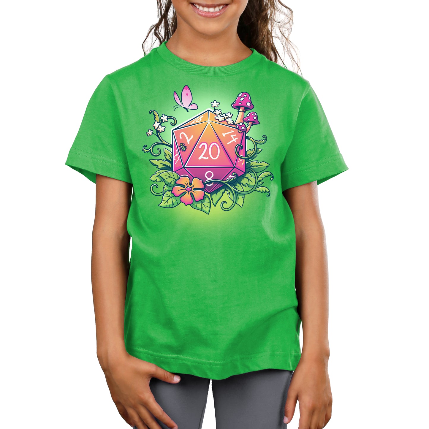 Premium Cotton T-shirt - Young girl wearing an apple green apparel made of super soft ringspun cotton, featuring a colorful design with a 20-sided die showing a Natural 20, surrounded by flowers, mushrooms, and a butterfly. The apparel is called Natural 20 by monsterdigital.