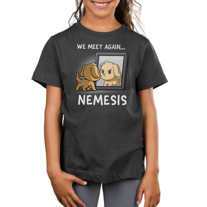 Premium Cotton T-shirt - A child wears a charcoal gray apparel featuring a cartoon dog looking at its reflection in a mirror with the text "We meet again... Nemesis," printed on super soft ringspun cotton. The product is called Nemesis, and it is by monsterdigital.