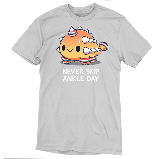 Silver gray T-shirt with a cartoon dinosaur character and the text 