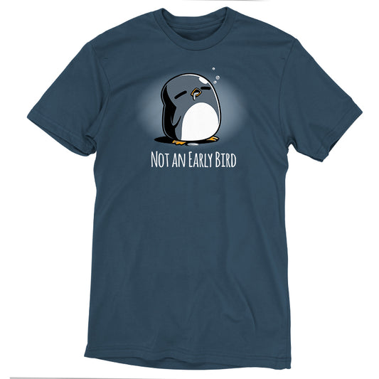 The Not an Early Bird by monsterdigital is a dark denim blue t-shirt featuring a sleepy cartoon penguin with closed eyes and the text 
