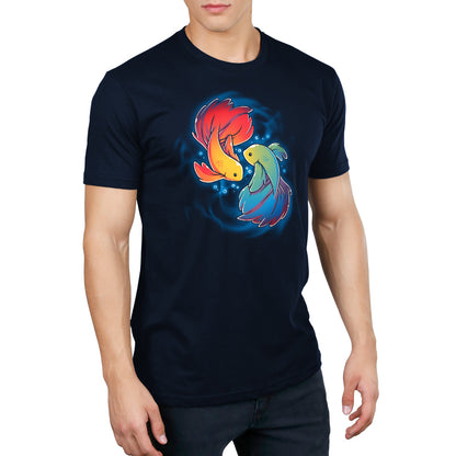 Man wearing a navy blue monsterdigital Rainbow Betta t-shirt with an illustration of two Rainbow Betta fish swimming in a circle pattern, made from super soft ringspun cotton.