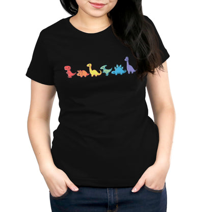 A person wearing a black, 100% super soft ringspun cotton T-shirt featuring the "Rainbow Dinos" by monsterdigital printed on the front.