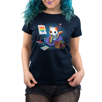 Premium Cotton T-shirt_TeeTurtle navy blue Arts and Crafts and Rainbows apparel featuring a cat knitting rainbow scarf, surrounded by a basket of rainbow yarn, rainbow notebook, and easel with rainbow artwork.