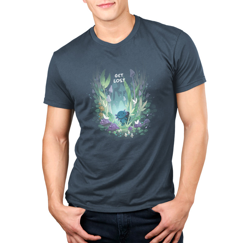 Man wearing a denim blue t-shirt with a graphic design featuring the phrase "get lost" surrounded by whimsical forest elements and a creature from monsterdigital's Axolotl Explorer collection.