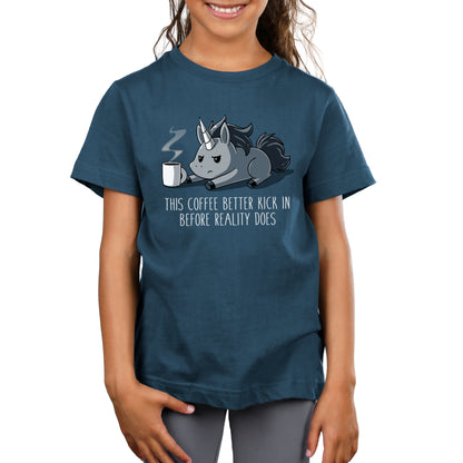 Premium Cotton T-shirt_Teeturtle denim blue Before Reality Kicks In apparel featuring a grumpy-looking unicorn on its stomach with a cup of steaming coffee in front of it. Caption reads 'This coffee better kick in before reality does".