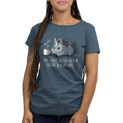 Teeturtle Denim Before Reality Kicks In Premium Cotton T-shirt. Featuring a grumpy-looking unicorn on its stomach with a cup of steaming coffee in front of it.