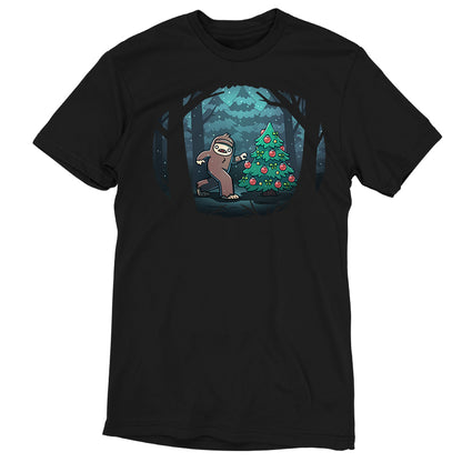 Premium Cotton T-shirt_TeeTurtle black Bigfoot Christmas apparel featuring a sasquatch caught putting holiday decor on a tree in the middle of a snowy forest.