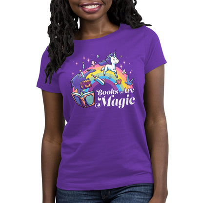 Person wearing a super soft ringspun cotton purple unicorn t-shirt featuring a rainbow and books with the text "Books Are Magic" by monsterdigital.