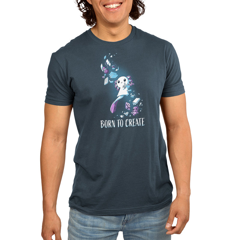 Premium Cotton T-shirt - Person wearing a denim blue apparel with a whimsical design of a creature surrounded by flowers and leaves, made of super soft ringspun cotton, with the phrase "Born to Create" printed below the design. The apparel is the Born to Create from monsterdigital.