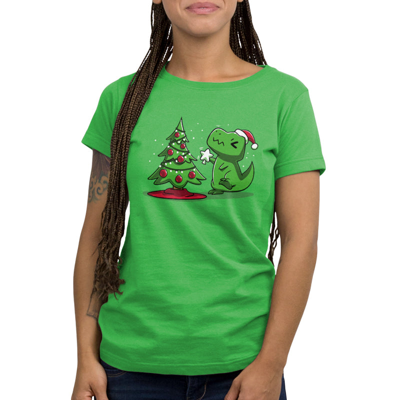 Premium Cotton T-shirt - Person wearing an apple green, super soft ringspun cotton monsterdigital Christmas T-Rex apparel, standing near a Christmas tree.