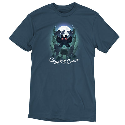 Premium Cotton T-shirt_TeeTurtle Cryptid Crew denim blue t-shirt featuring a whimsical illustration of six cartoon cryptids, including a mothman and a jackalope, in a forest with a full moon in the background. Text at the bottom reads "Cryptid Crew."