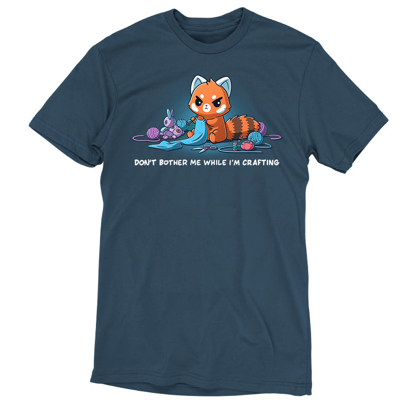 Premium Cotton T-shirt_TeeTurtle denim blue Don't Bother Me While I'm Crafting featuring an introverted, knitting red panda surrounded by knitting materials.