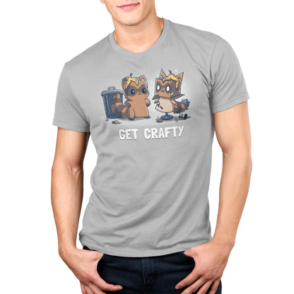 Man wearing a gray unisex Crafty Raccoon tee by monsterdigital with a graphic of two cartoon racoons and the text "get crafty" printed on it.